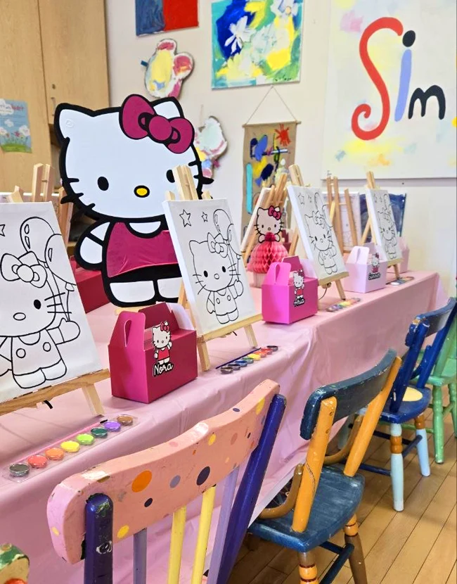 Kids art studio in Toronto with easels, canvas supplies, and Hello Kitty decoration
